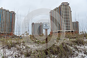 PENSACOLA, FLORIDA - APRIL 14, 2016: Keep of Dunes sign in Pensacola Beach. Portofino Tower in Background