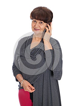 Pension age good looking woman talking on the mobile phone, London