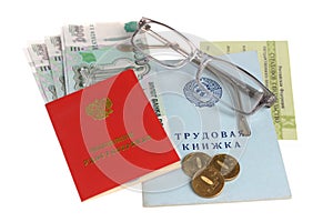 Pension documents, money and glasses