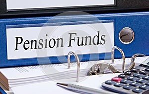 Pension Funds - blue binder with text in the office