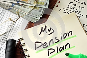 Pension plan written on a notepad.