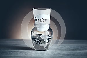 Pension word with coin in glass jar