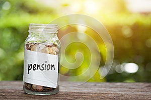 Pension Word With Coin In Glass Jar.