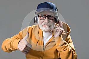 Pensioner in amazement giving thumb up