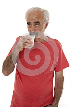 Pensioner drinking milk
