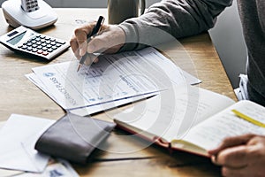 Pensioner filling out a form