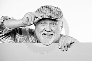 Pensioner grandfather in vintage hat hold poster information copy space. Announcement concept. Advertisement shop