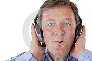 Pensioner with headphones singing to mp3 music