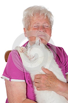 Pensioner hugging her white tomcat