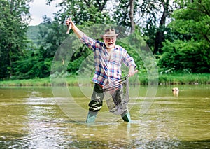 Pensioner leisure. Fish farming pisciculture raising fish commercially. Fisherman fishing equipment. Fisherman alone