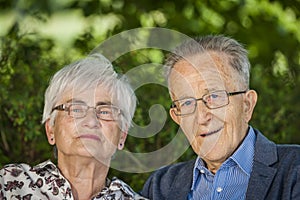 Pensioner portraits with glasses outdoor