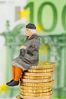 Pensioner sitting on cash pile