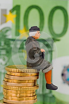 Pensioner sitting on cash pile