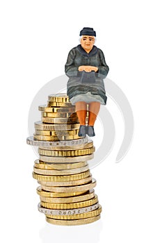 Pensioner sitting on a pile of money