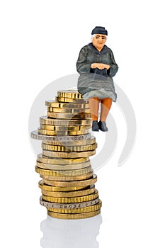 Pensioner sitting on a pile of money