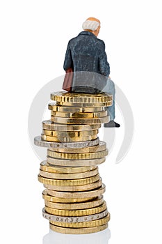 Pensioner sitting on a pile of money