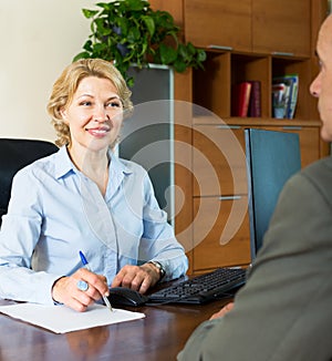 Pensioner talking with manager