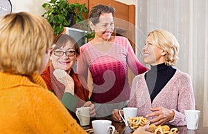 Pensioners having cup of tea photo