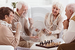 Pensioners playing chess photo