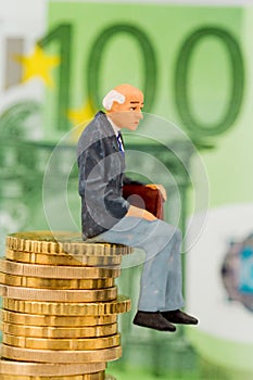 Pensioners sitting on cash pile photo