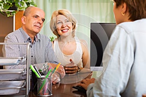 Pensioners talking with manager