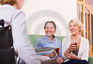 Pensioners visiting disabled friend