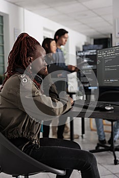 Pensive african american app developer programming code development