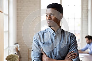 Pensive african American man look in distance thinking