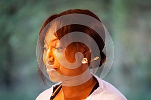 Pensive African American Woman with Elegant Earrings