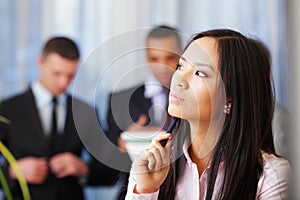 Pensive asian businesswoman