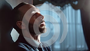 Pensive bearded male in suit thinking at luxury hotel interior. Close up shot on 4k RED camera