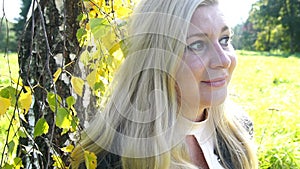 Pensive beautiful Blonde woman in park feel inspiration autumn mood yellow silence background