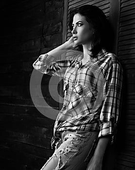 Pensive beautiful loneliness woman in trendy black and white che