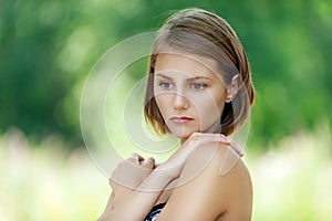 Pensive beautiful young woman