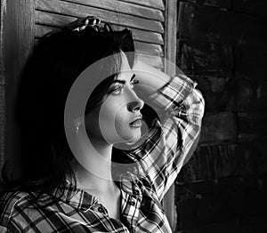 Pensive beautiful young woman profile in trendy black and white