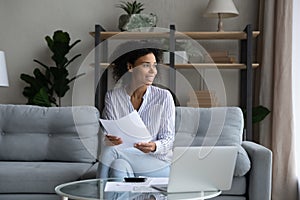 Pensive biracial manage budget pay bills online