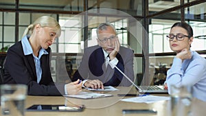 Pensive bored office employees sitting table, lack of ideas occupational burnout