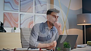 Pensive boss working laptop creating ideas at desk closeup. Winner man rejoicing