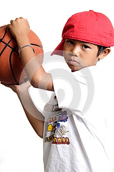 Pensive boy holding a basketball
