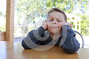 Pensive boy waiting food