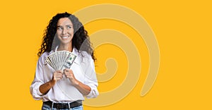 Pensive Brunette Woman Holding Dollar Cash And Looking At Copy Space