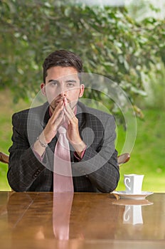 Pensive businessman with concentration at home