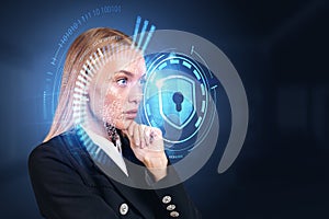 Pensive businesswoman with hand on chin, cybersecurity hologram with shield