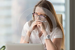 Pensive businesswoman thinking about problem