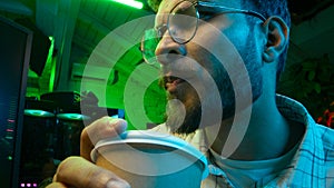 Pensive Caucasian man professional software engineer guy male coder programmer crypto specialist drinking coffee