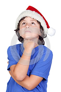 Pensive child with Santa hat