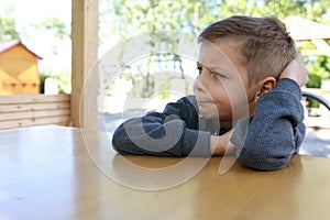 Pensive child waiting food