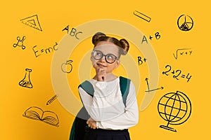 Pensive Cute Schoolgirl Standing Over Yellow Background With Drawn Educational Icons