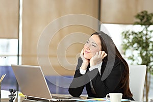 Pensive and distracted office worker looking at side