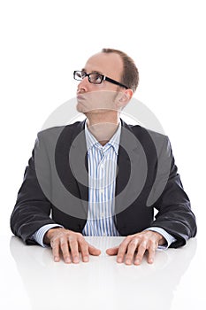 Pensive and doubtful isolated businessman looking at the side we